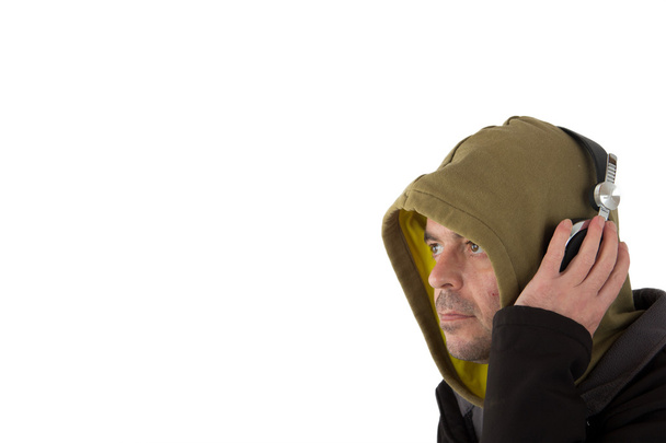 Muž v hoodie poslechu sluchátka - Fotografie, Obrázek
