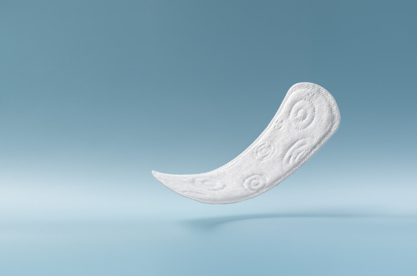 woman's sanitary pad on color back - Photo, image