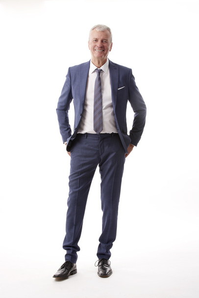senior businessman standing  - Фото, изображение
