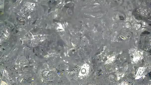 Pouring soda water on ice cubes - 映像、動画