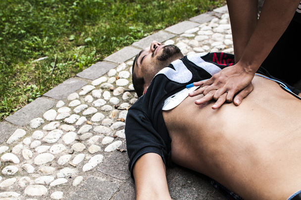 vital parameters and cardiac massage for CPR with defibrillator - Photo, Image