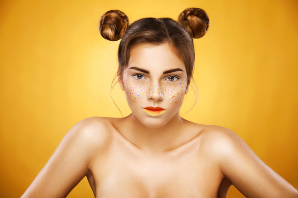 Portrait of bright beautiful girl with art colorful freckles make-up - Foto, imagen