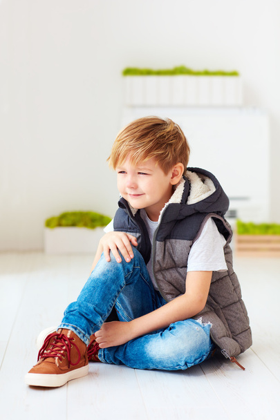 portrait of cute fashionable kid, boy sitting on the floor - Zdjęcie, obraz