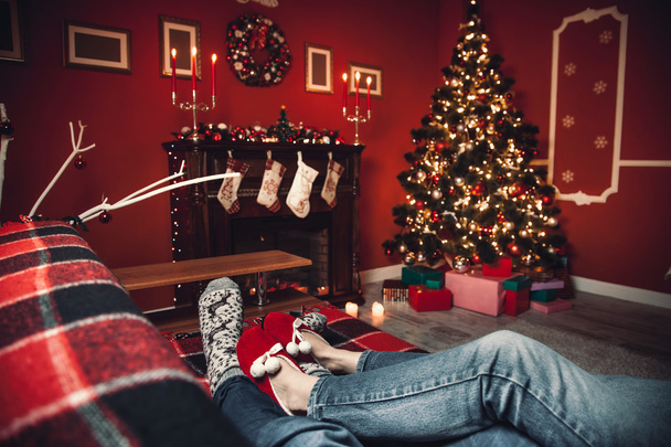 couple of lovers in the Christmas room - Фото, изображение