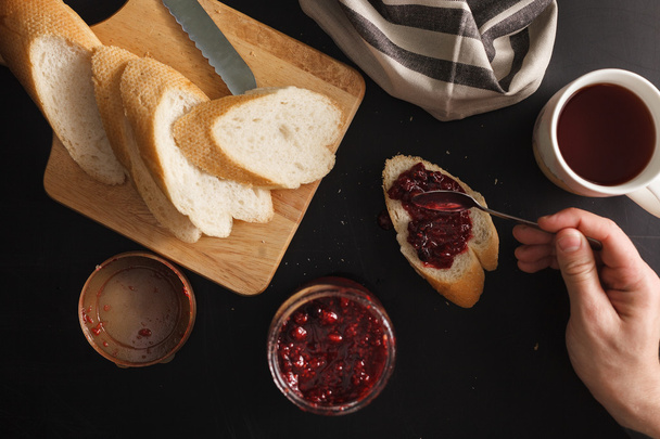 Breakfast  with bread and raspberries jam - Photo, Image