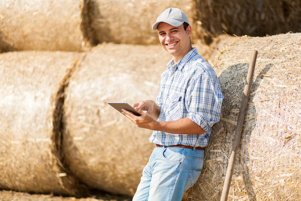 Farmer using tablet in field  - Foto, Imagen