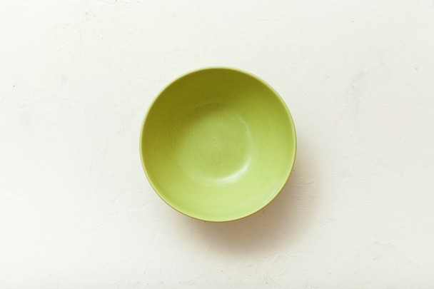 top view of green bowl on plastering plate - 写真・画像