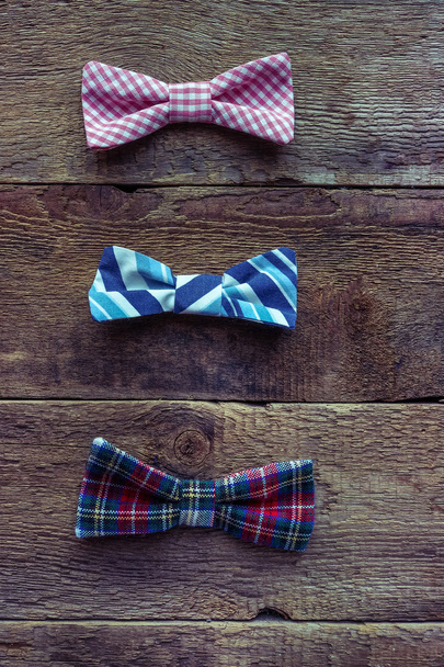 Set of  bow-ties over grunge wooden background - Foto, Imagem