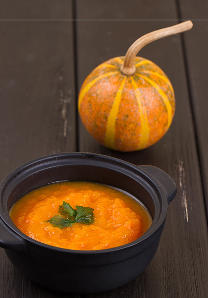 Pumpkin soup on a wooden table - Photo, Image
