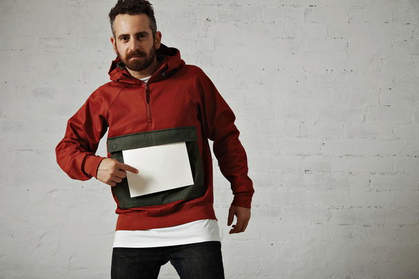 Man in red anorak with white paper - Photo, Image
