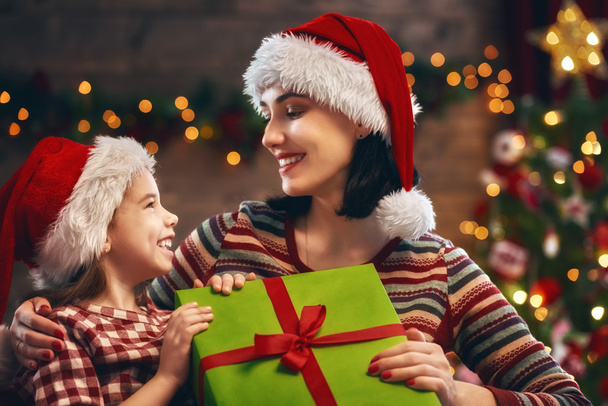 Mother and daughter exchanging gifts - Photo, Image