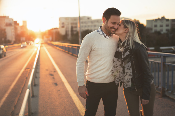 Couple kissing and dating on bridge - Zdjęcie, obraz