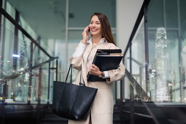 Successful businesswoman holding folder - Fotoğraf, Görsel