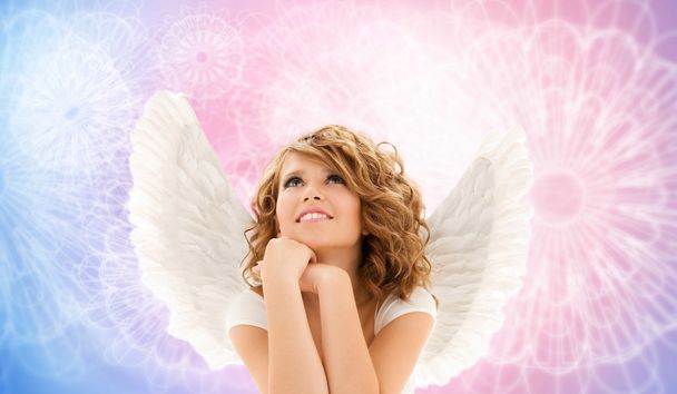 happy young woman or teen girl with angel wings - Fotoğraf, Görsel