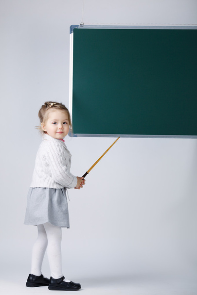 cute little girl with blackboard - 写真・画像