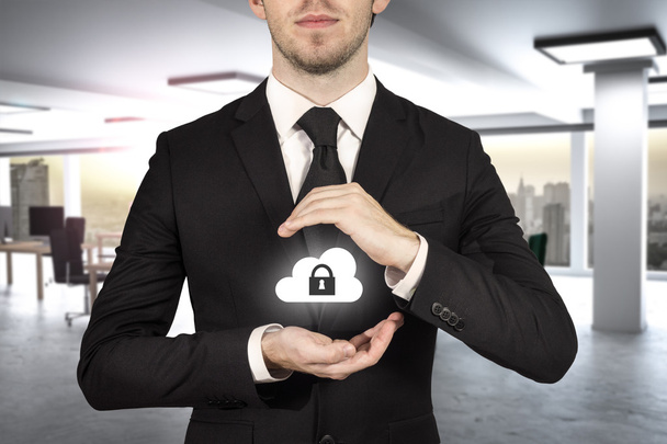 businessman protect cloud lock symbol with hands - Foto, imagen