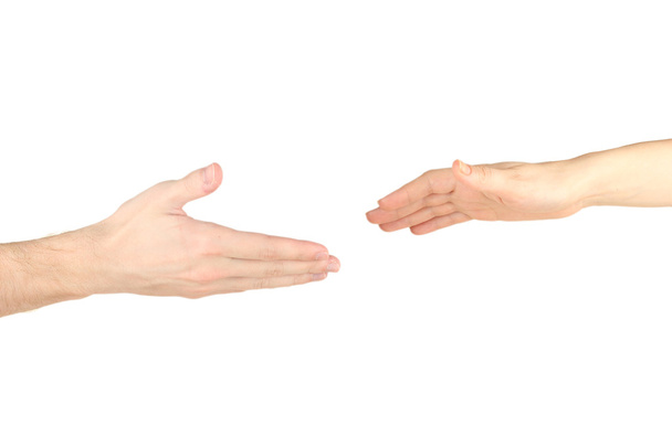 Women's hand goes to the man's hand on white background - Foto, Bild