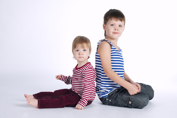 two funny siblings portraits on white background - Foto, Imagem