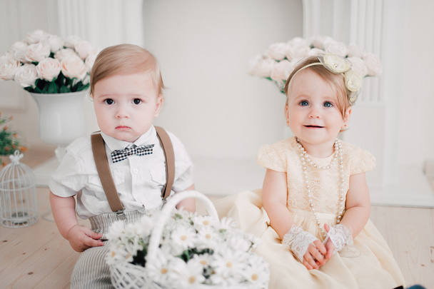 two babies wedding - boy and girl dressed as bride and groom - Fotoğraf, Görsel