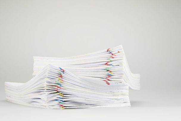 Pile overload of paperwork place on white background - Foto, afbeelding