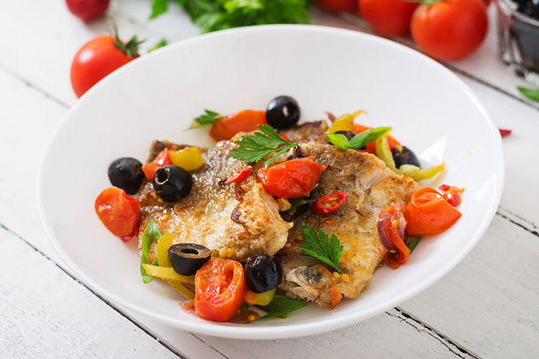 Fried hake fillet with tomato and olives - Photo, Image