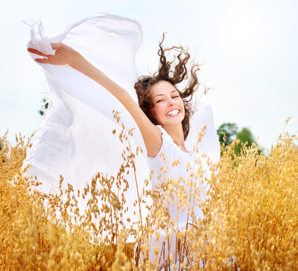 Beautiful Happy Girl on the Wheat Field - Фото, зображення