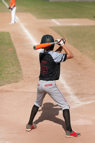 Teen baseball player batting - 写真・画像