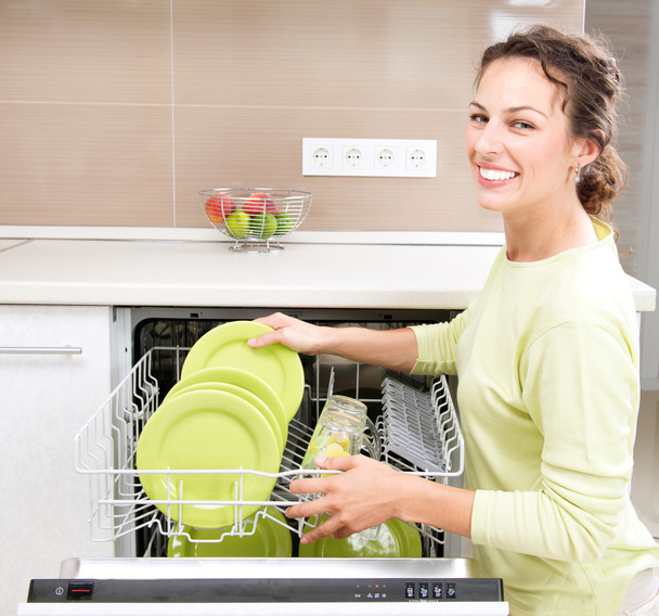 Dishwasher. Young woman in the Kitchen doing Housework. Wash-up - Foto, Imagem