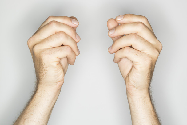 two caucasian hands in a gesture: holding something - Photo, Image