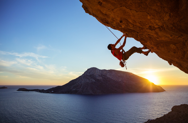 climber on overhanging rock - 写真・画像