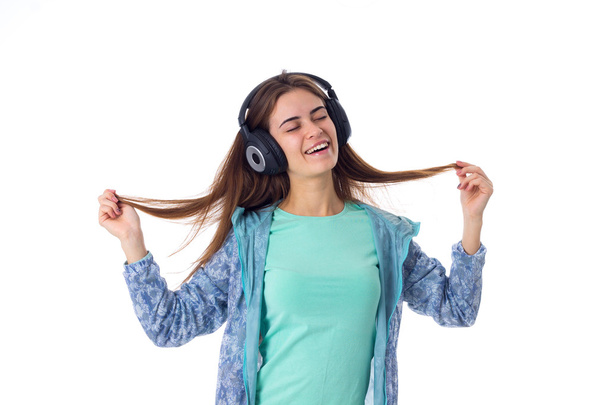 Mujer joven en auriculares
 - Foto, Imagen