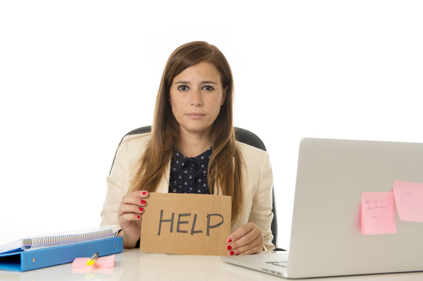 sad desperate businesswoman in stress at office computer desk holding help sign - Photo, Image