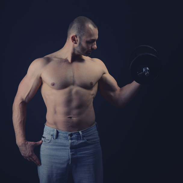 athletic man with dumbbells - Photo, Image