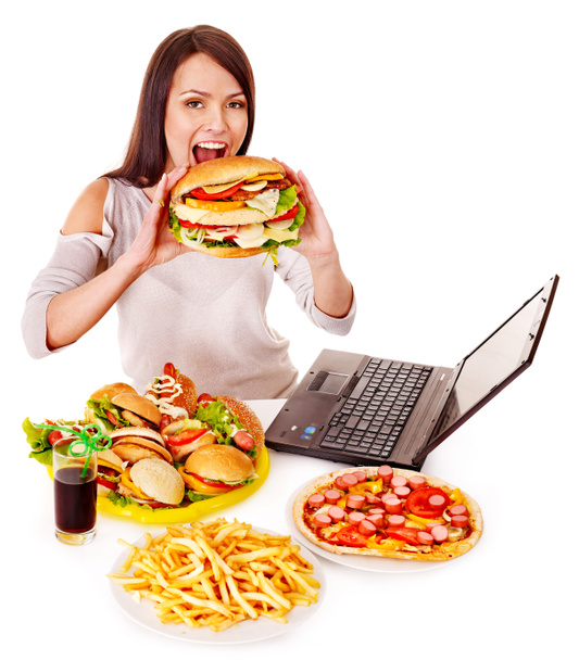 Woman eating junk food. - Foto, afbeelding
