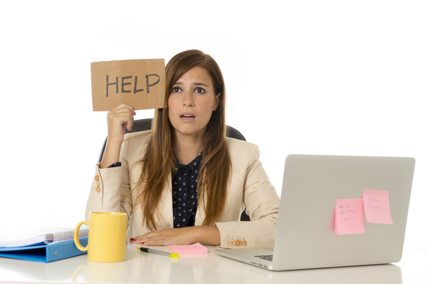sad desperate businesswoman in stress at office computer desk holding help sign - Photo, Image