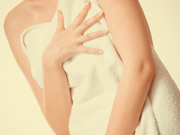 Woman covering breast under towel. - Foto, Imagem