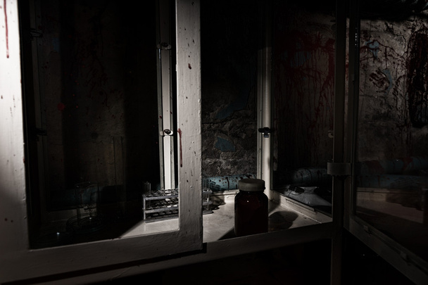 Blood stained laboratory with glass case and tubes - Photo, Image