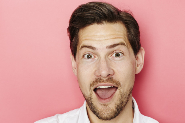 Handsome excited guy - 写真・画像