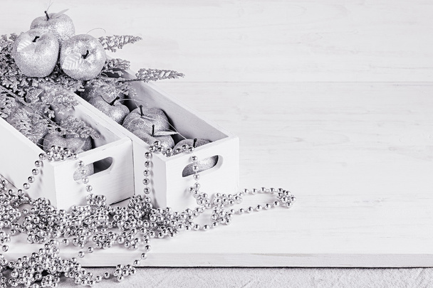 Christmas soft silver decorations in white boxes on a white wooden background. - Foto, immagini