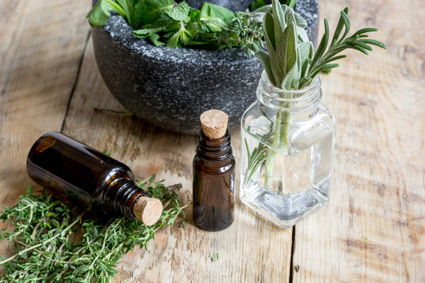 aromatherapy herbal preparation at wooden background - Photo, Image