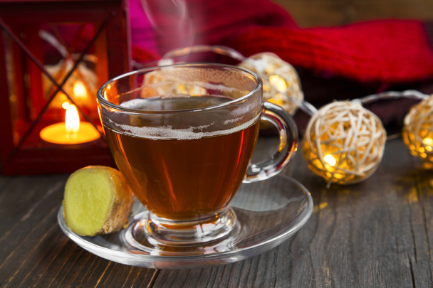 Winter ginger tea cup with candle lantern and lights - Photo, Image