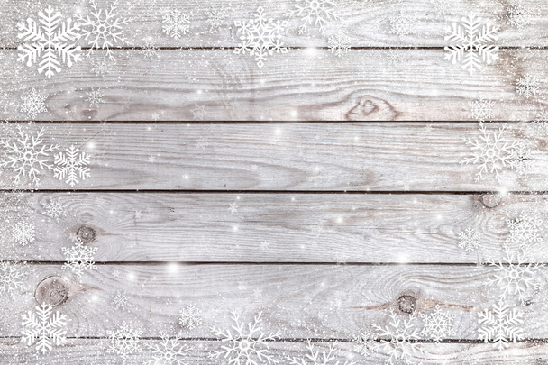 sneeuwvlokken op een houten achtergrond. - Foto, afbeelding