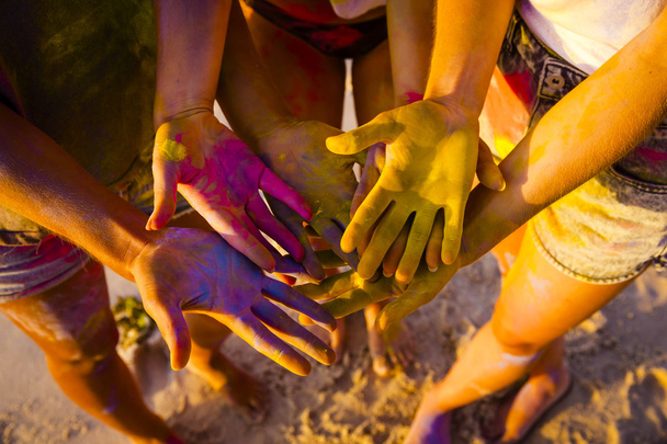 female hands full of colored powder  - Zdjęcie, obraz