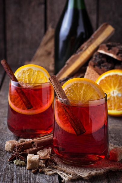 Glasses of mulled wine with orange and cinnamon - Photo, image