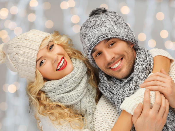 happy family couple in winter clothes hugging - Valokuva, kuva