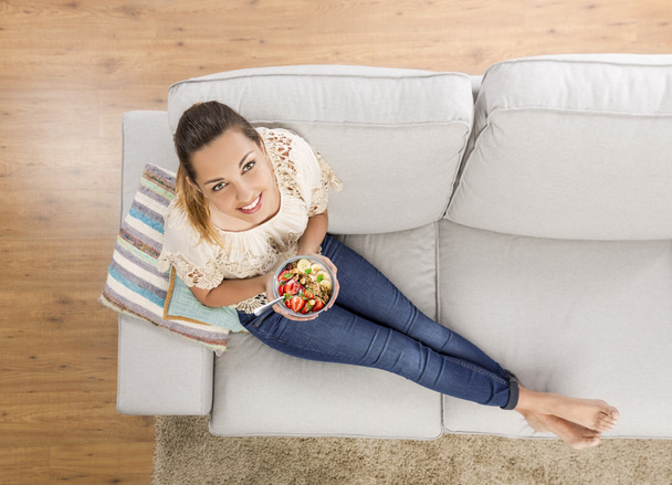 woman in beige blouse sitting on sofa - Photo, Image