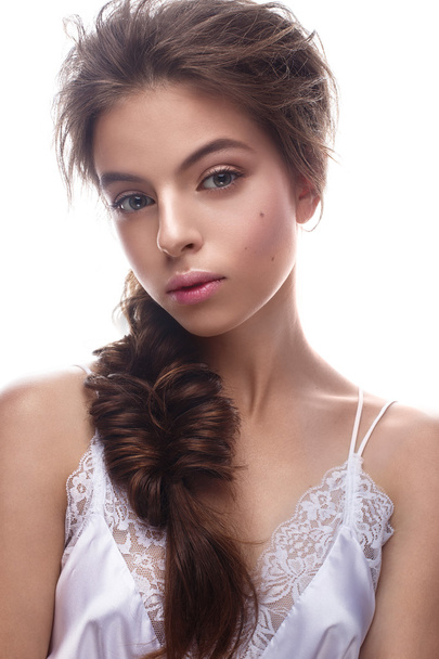 Beautiful girl in image of bride with plait. Model with nude makeup and silk underwear. Beauty face. - Fotó, kép