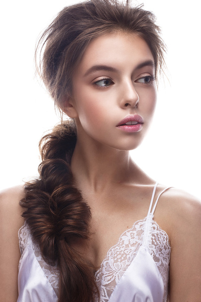 Beautiful girl in image of bride with plait. Model with nude makeup and silk underwear. Beauty face. - Фото, зображення