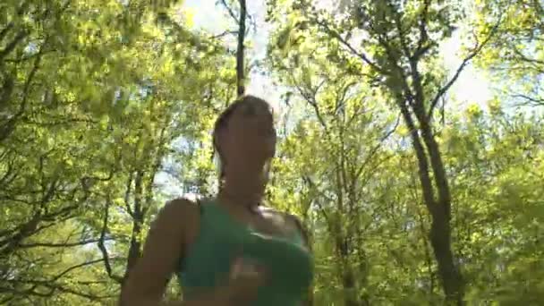young woman jogging in spring park  - Video