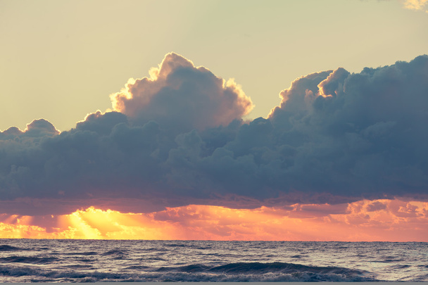 Beatiful sunset with clouds over the Baltic sea - 写真・画像